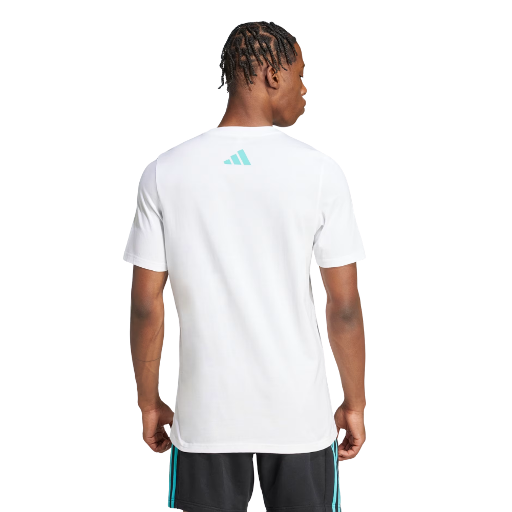 Person wearing a white Adidas t-shirt with a logo on the back, standing against a white background.